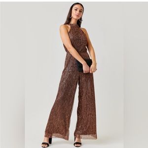Francesca’s gold jumpsuit